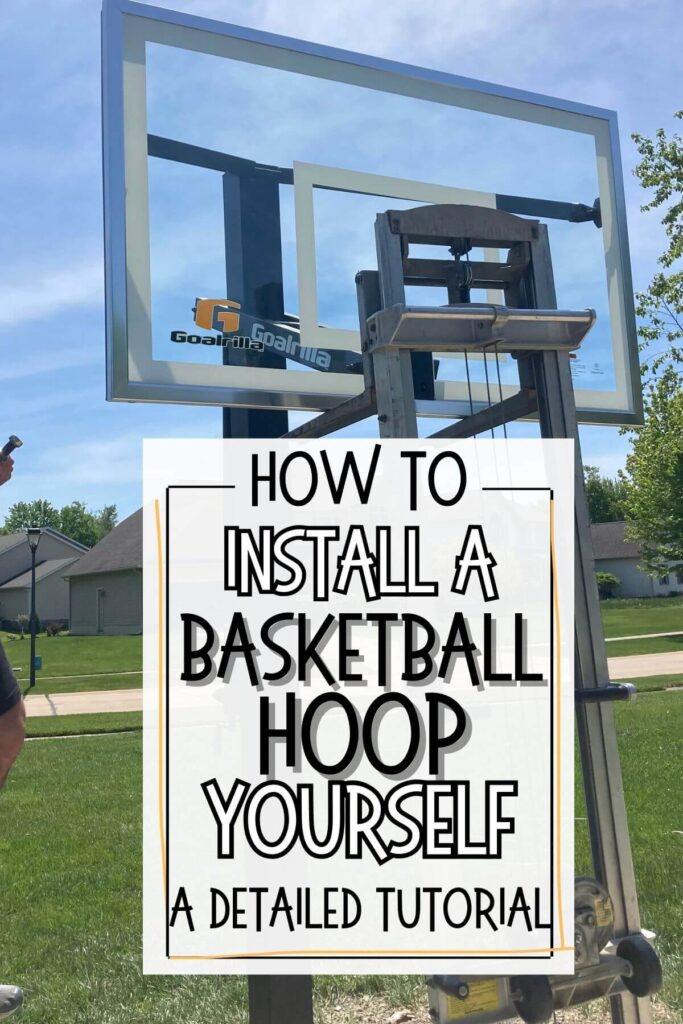 lift holding backboard up on basketball hoop with text how to install a basketball hoop yourself detailed tutorial.