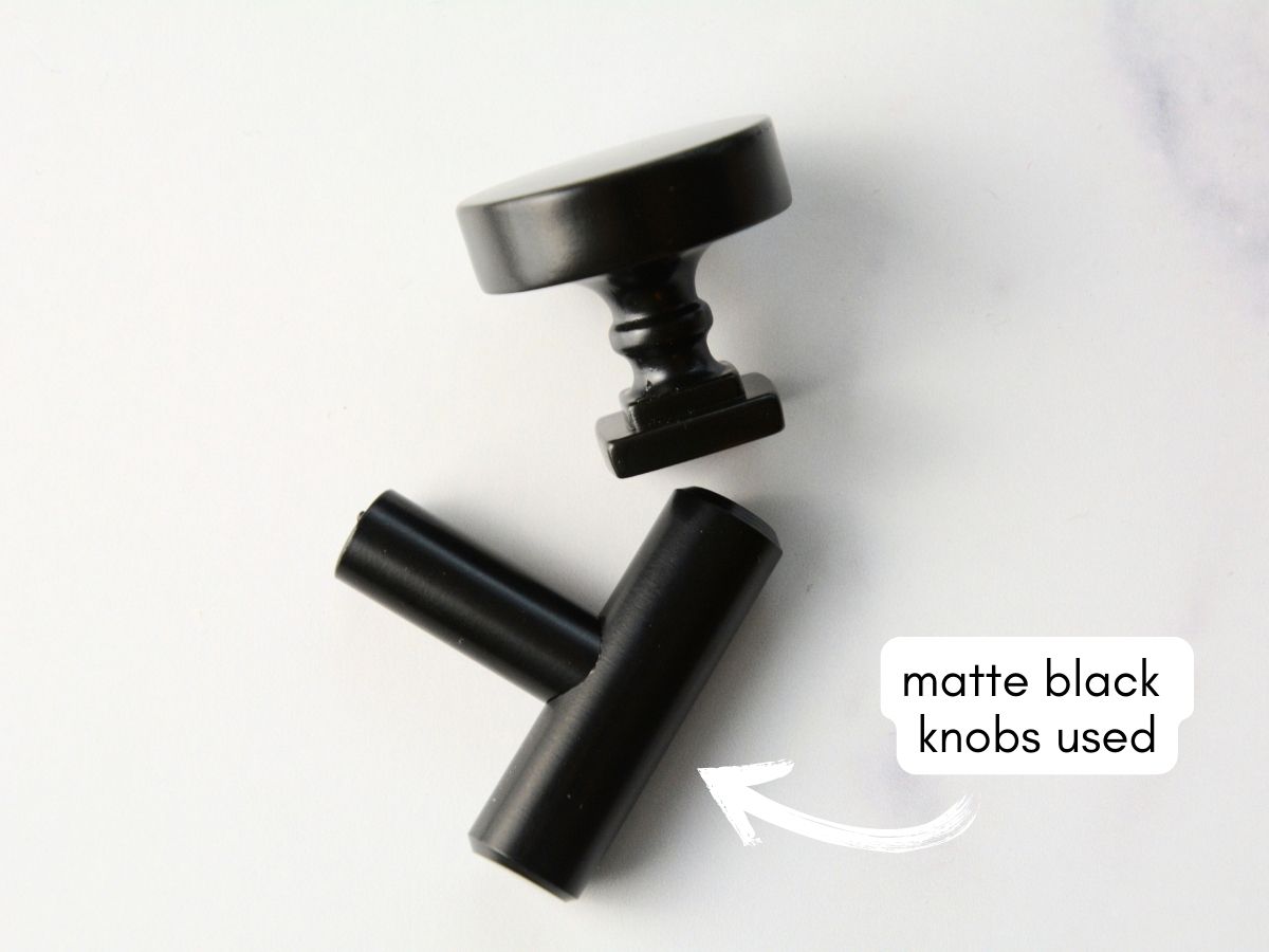 two matte black hardware knobs on white table with text overlay matte black knobs used.
