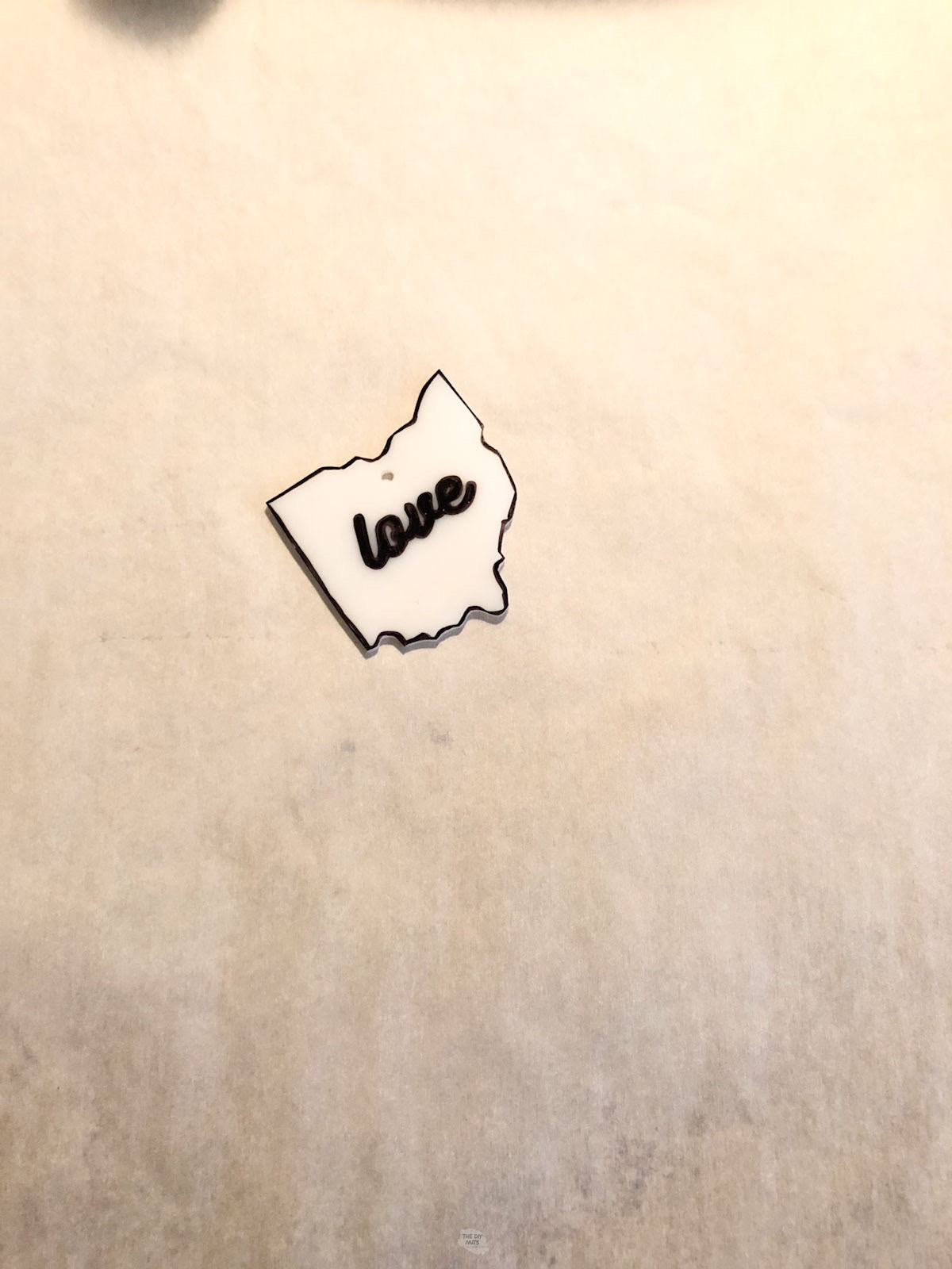 shrinky dink of ohio with cursive love inside.