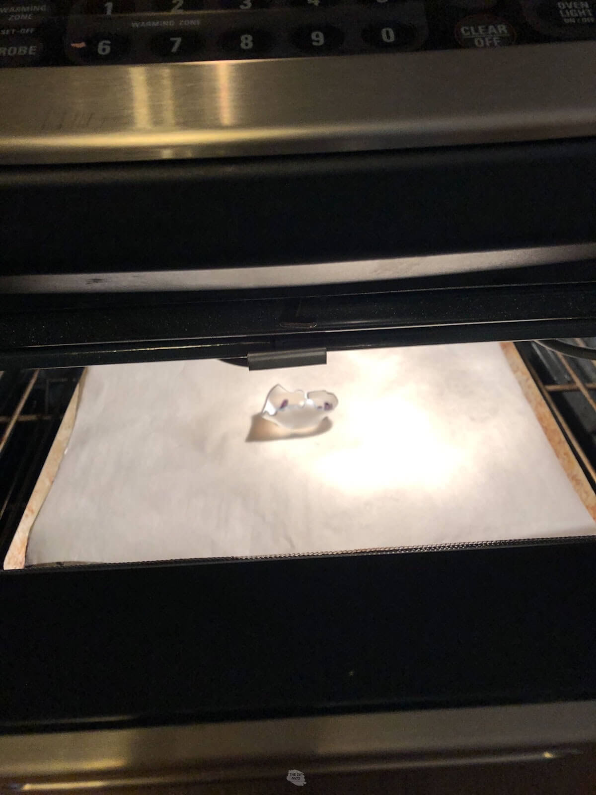 curled up shrinky dink on cookie sheet in oven.