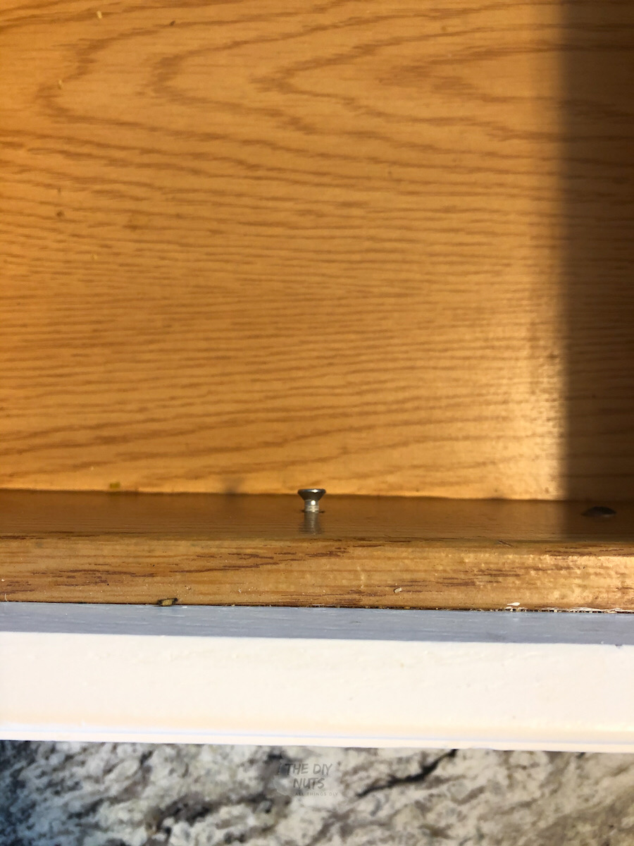 hardware screw inside kitchen cabinet drawer