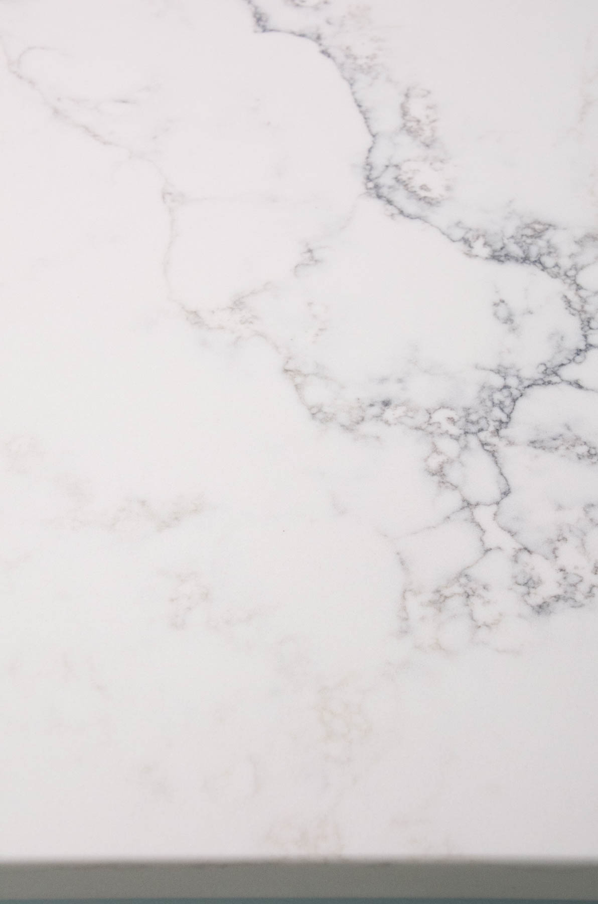 white quartz countertop with gray veining.