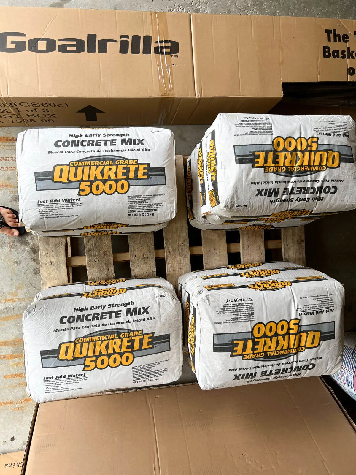 bags of Quickcrete stacked on a pallet.