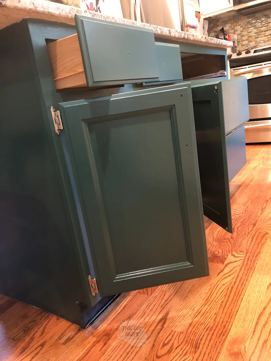 painted cabinet open to in kitchen.
