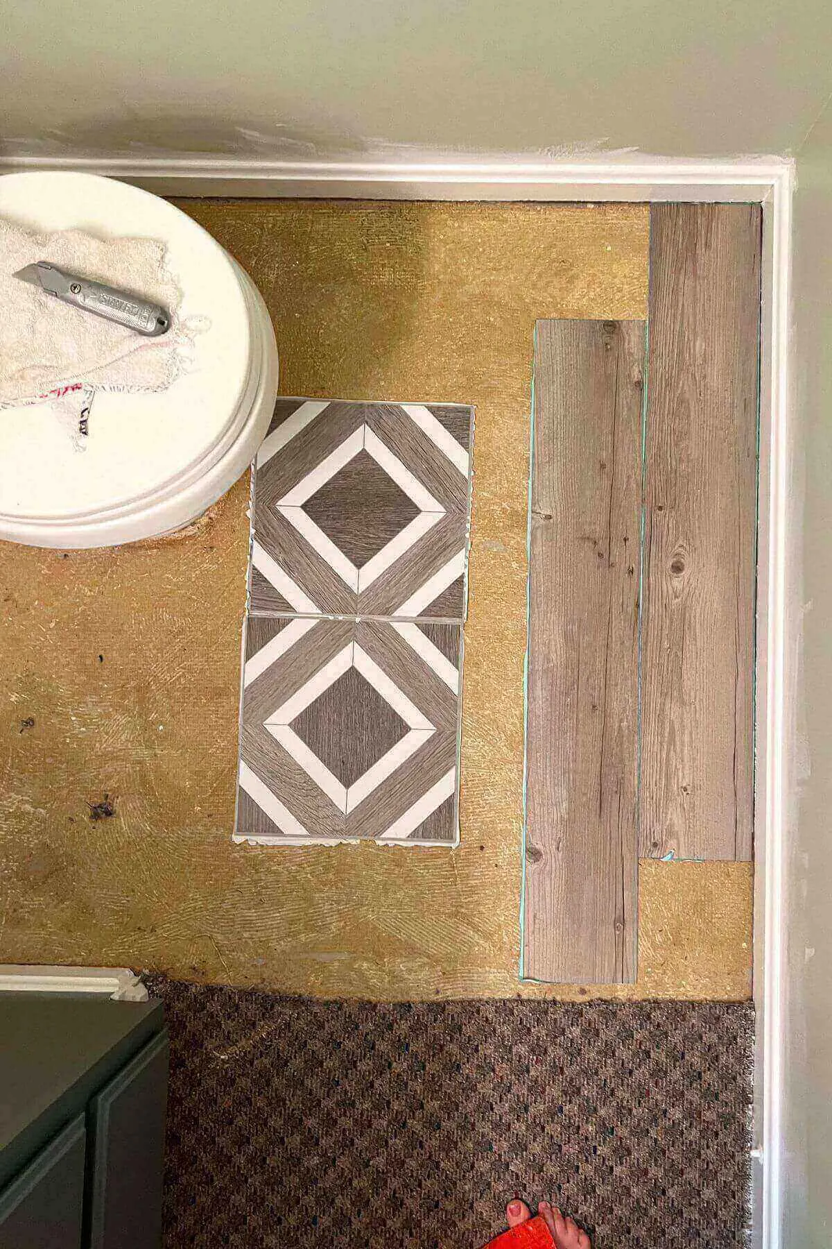 peel and stick tiles options on part of bathroom floor.