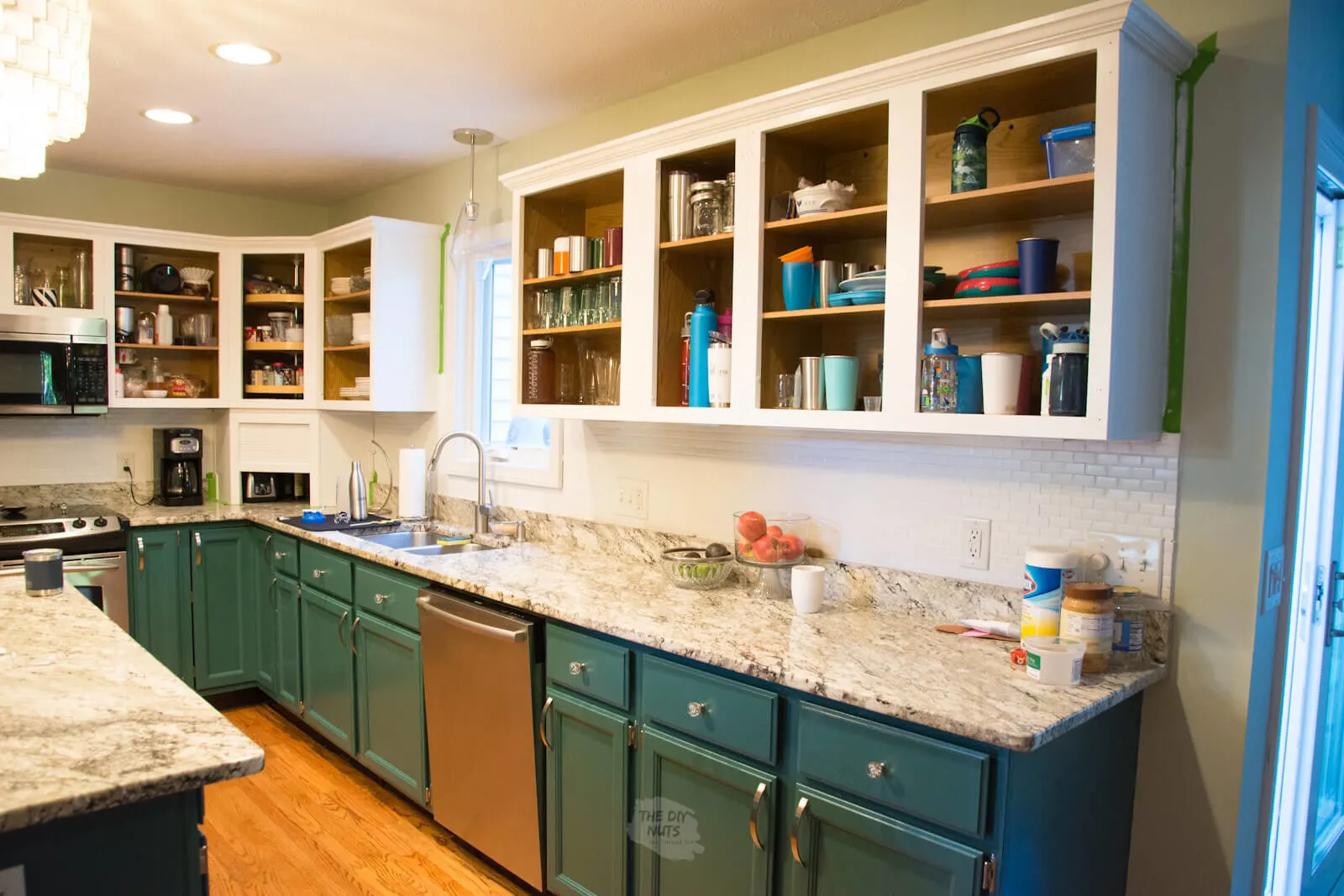 painted kitchen cabinets with granite counters.