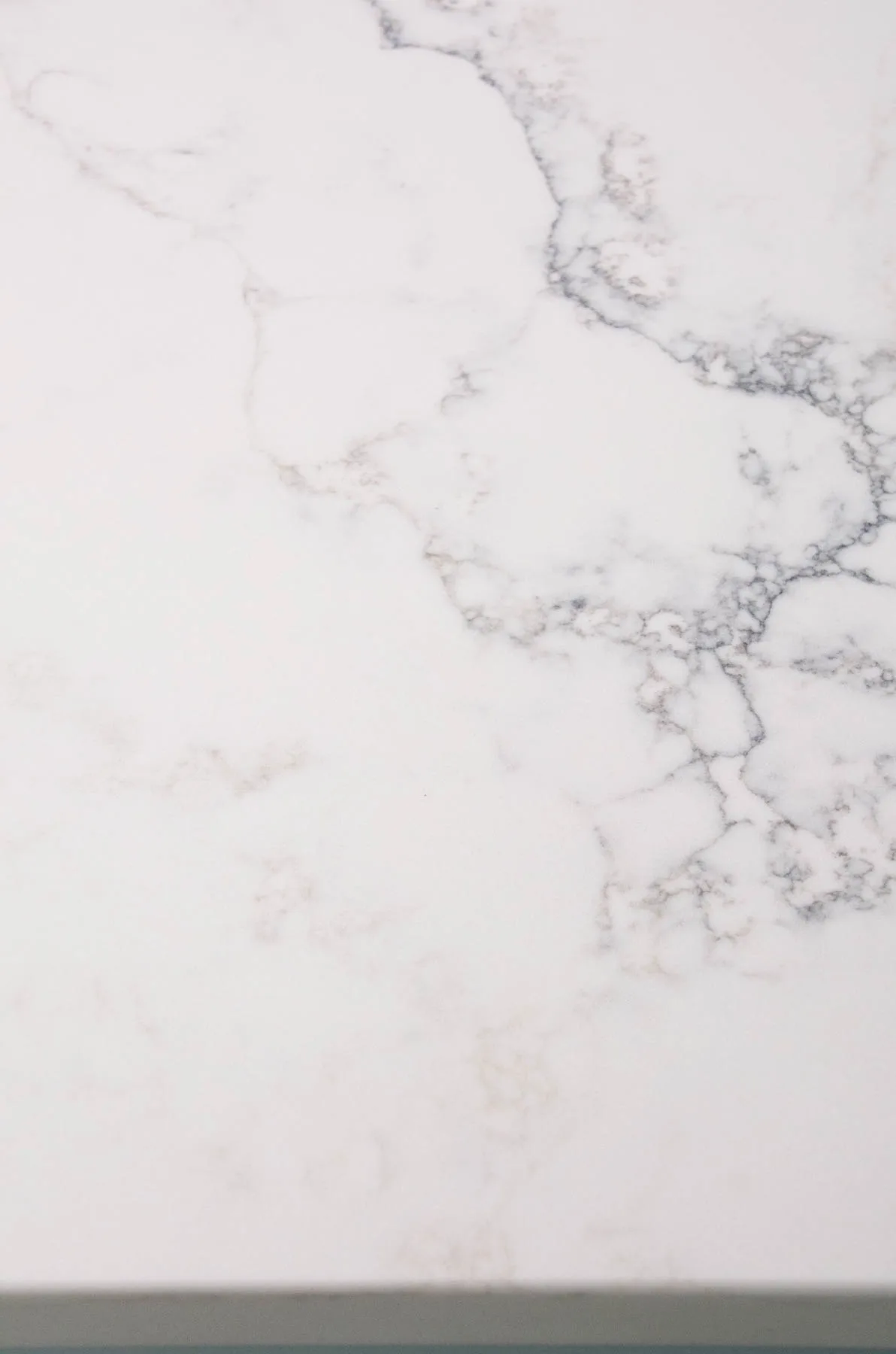 white quartz countertop with gray veining.